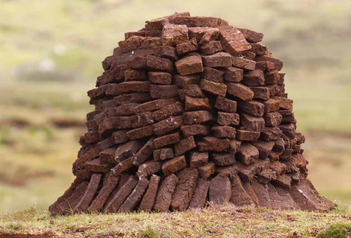 Peat cutters use shovels which cut down through layers of bog and cut out large ‘bricks’ of peat, which are then left in stacks to dry.